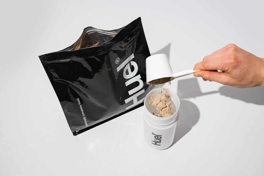 A bag of Huel and protein scoop
