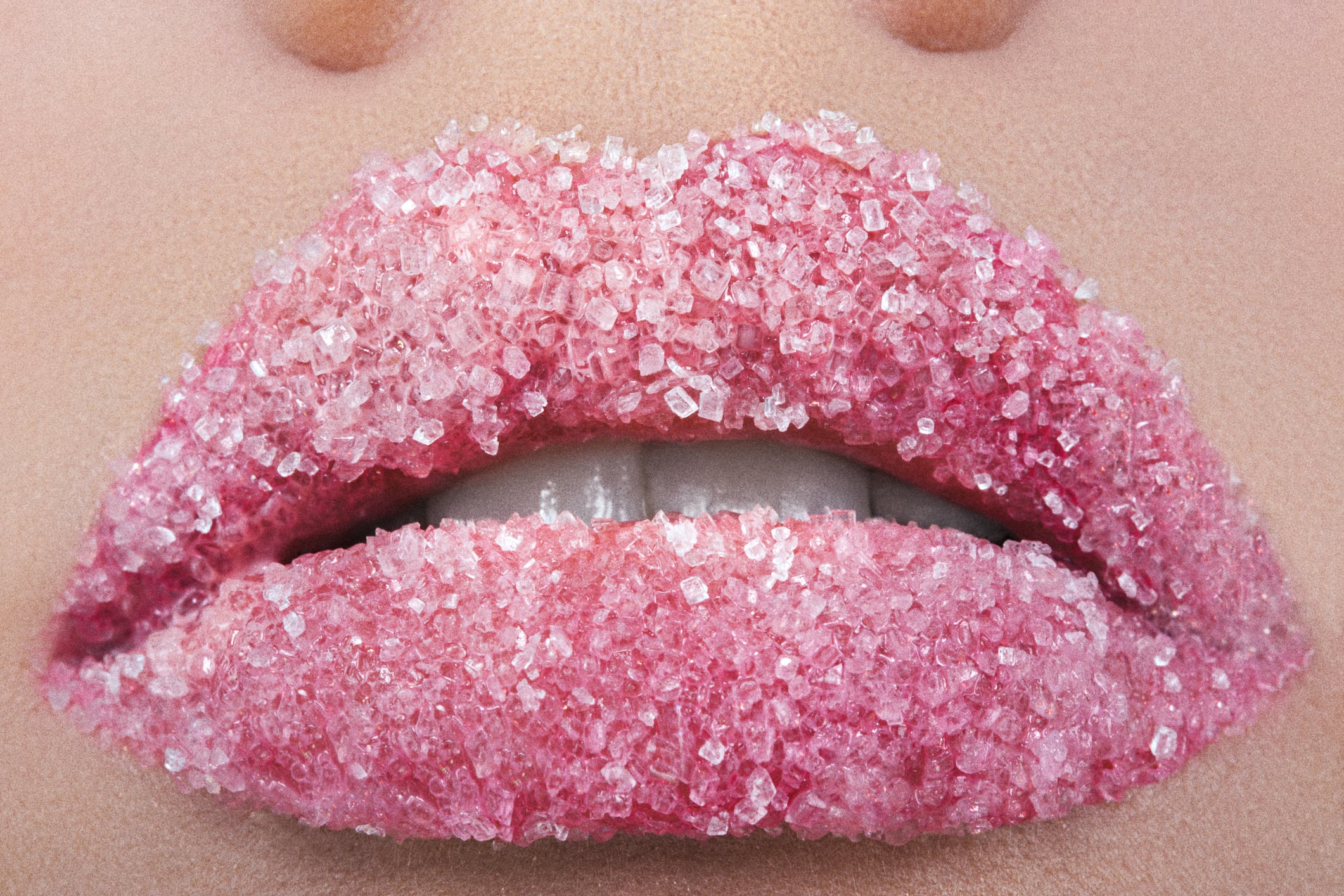 Female lips sprinkled with sugar