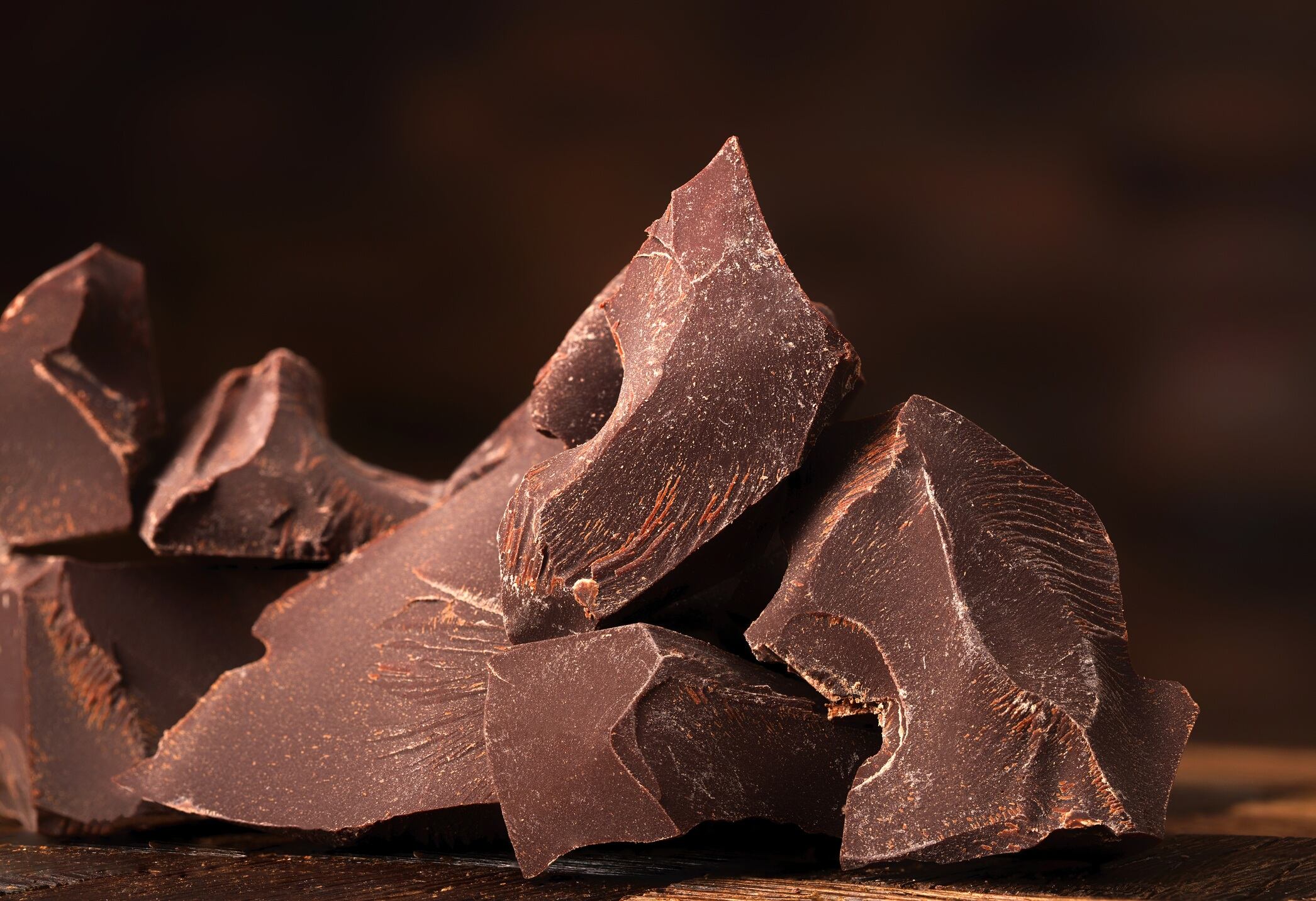 Rough-cut pieces of dark chocolate.