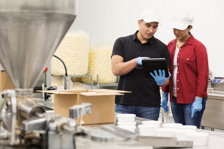 Snack-factory-tech-workers-using-tablet-Getty.jpg