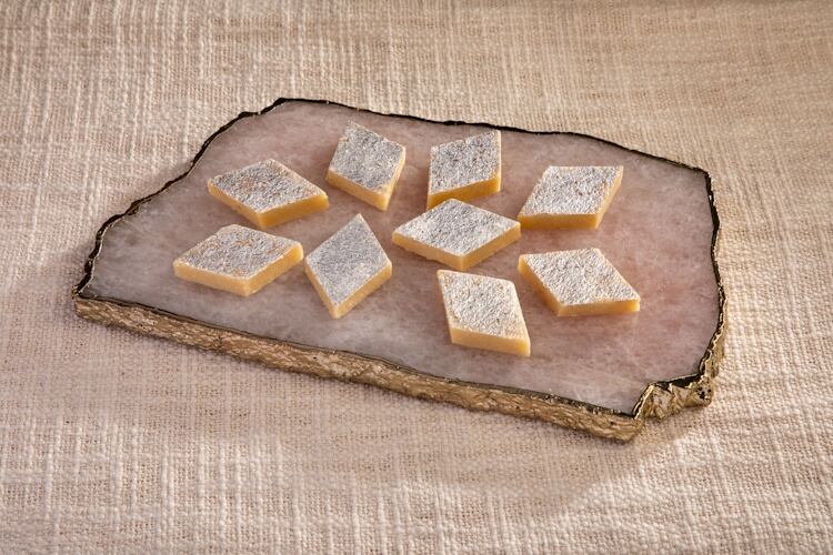 Diamond-cut Kaju Katli, made from cashews, sugar and ghee, embodies the rich simplicity of India’s festive sweets.