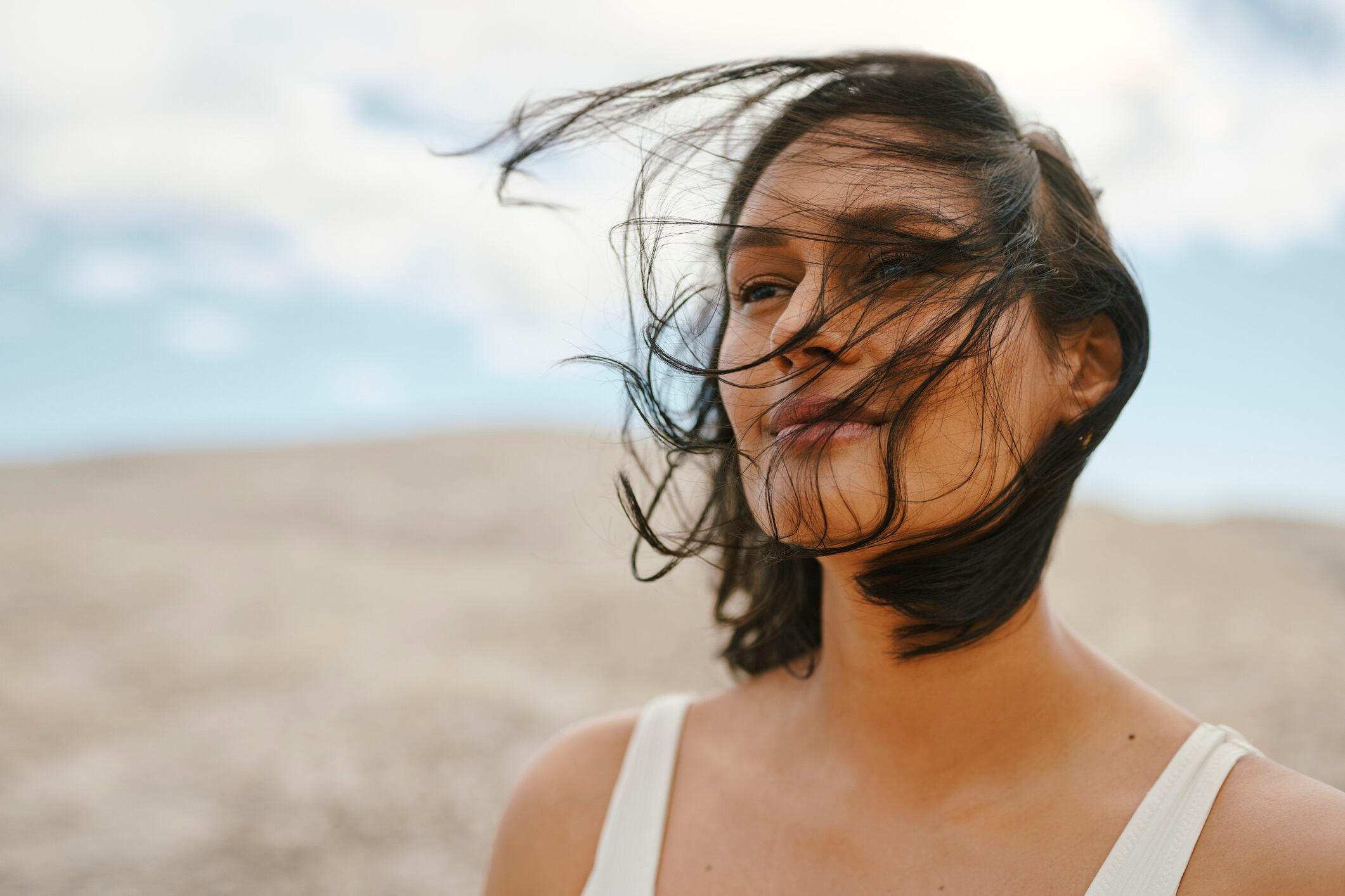 Woman with wind blowing her hair