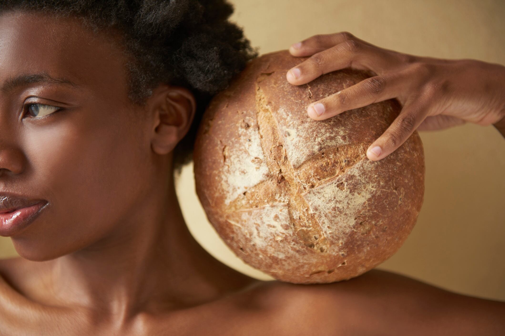 African woman with loaf of bread
