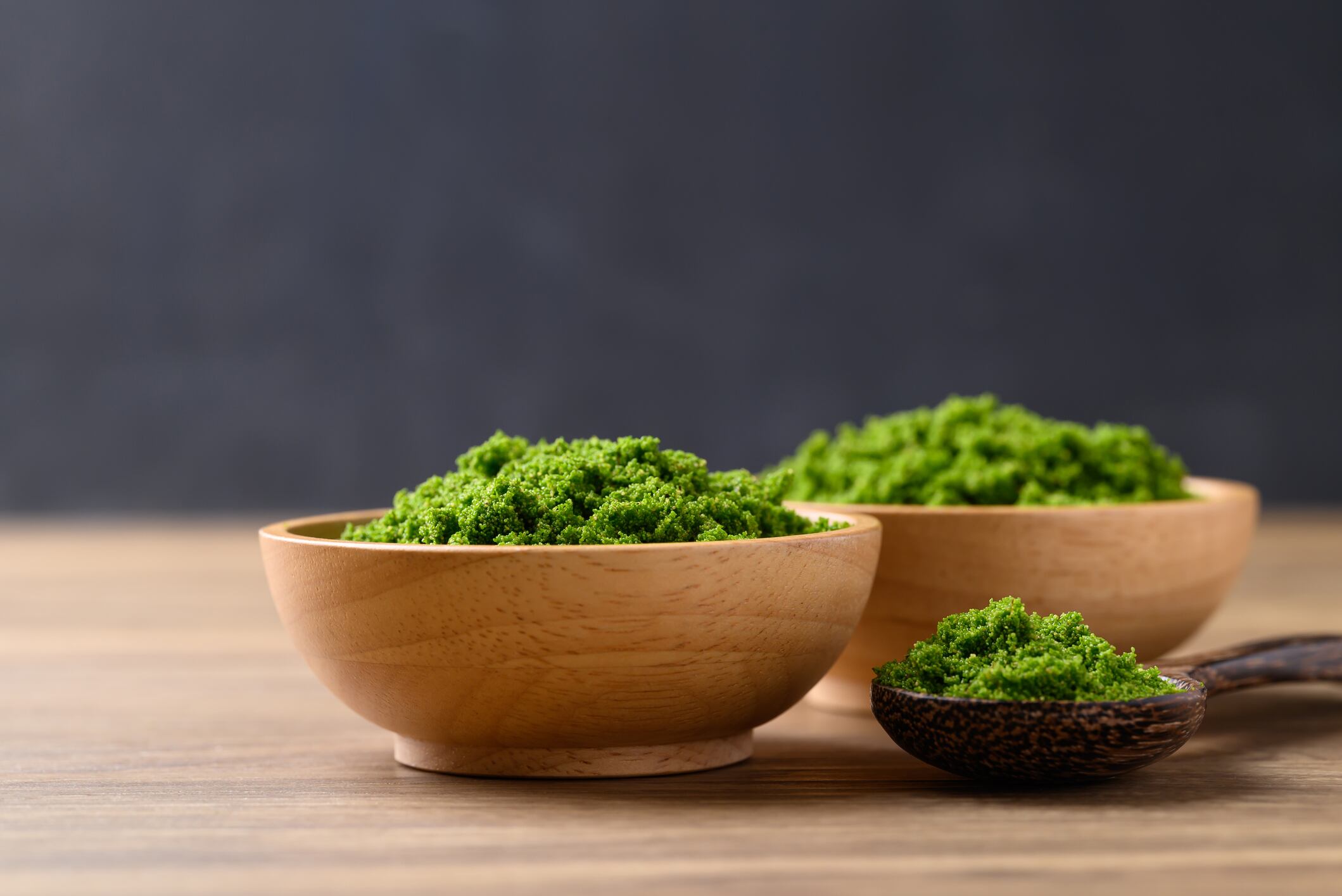 Duckweed can help food and drink manufacturers make high-protein claims. Wolffia or water meal in bowl, Edible small aquatic plant high protein.